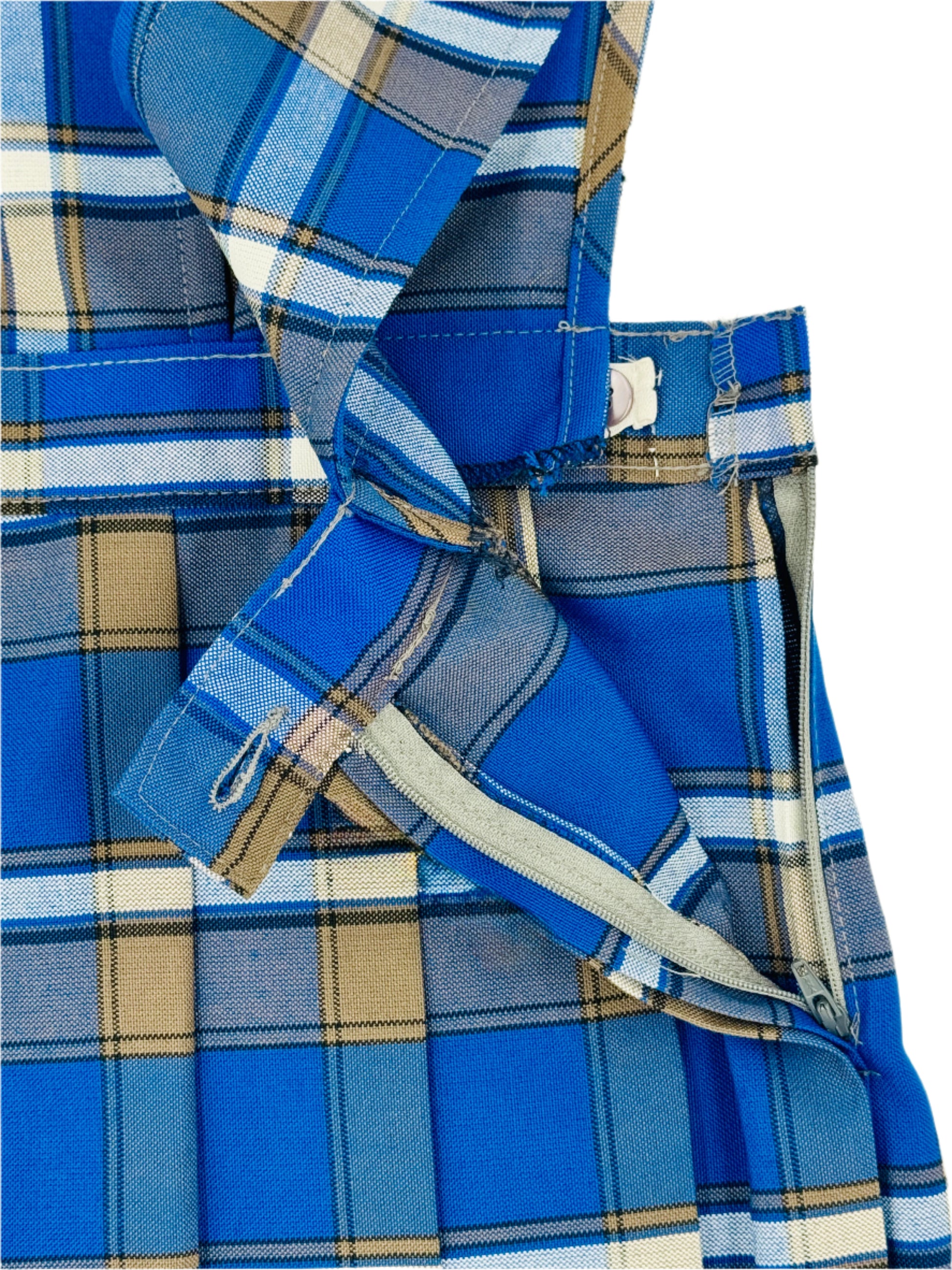 Close-up of a blue plaid shirt with a beige background