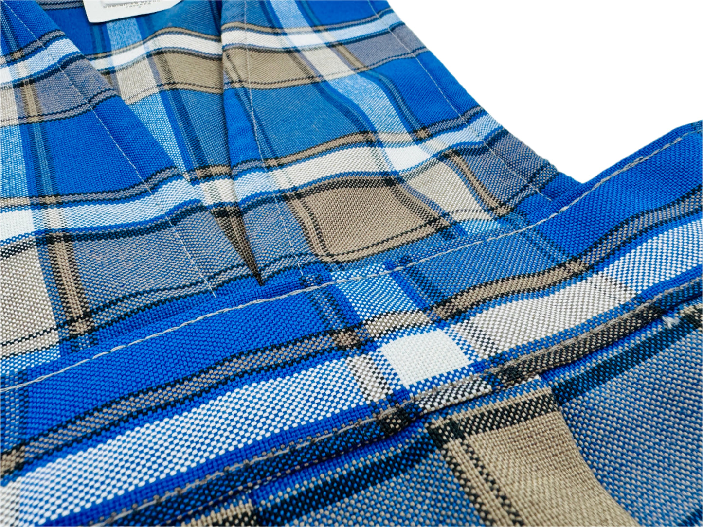 Close-up of blue plaid fabric with a white background