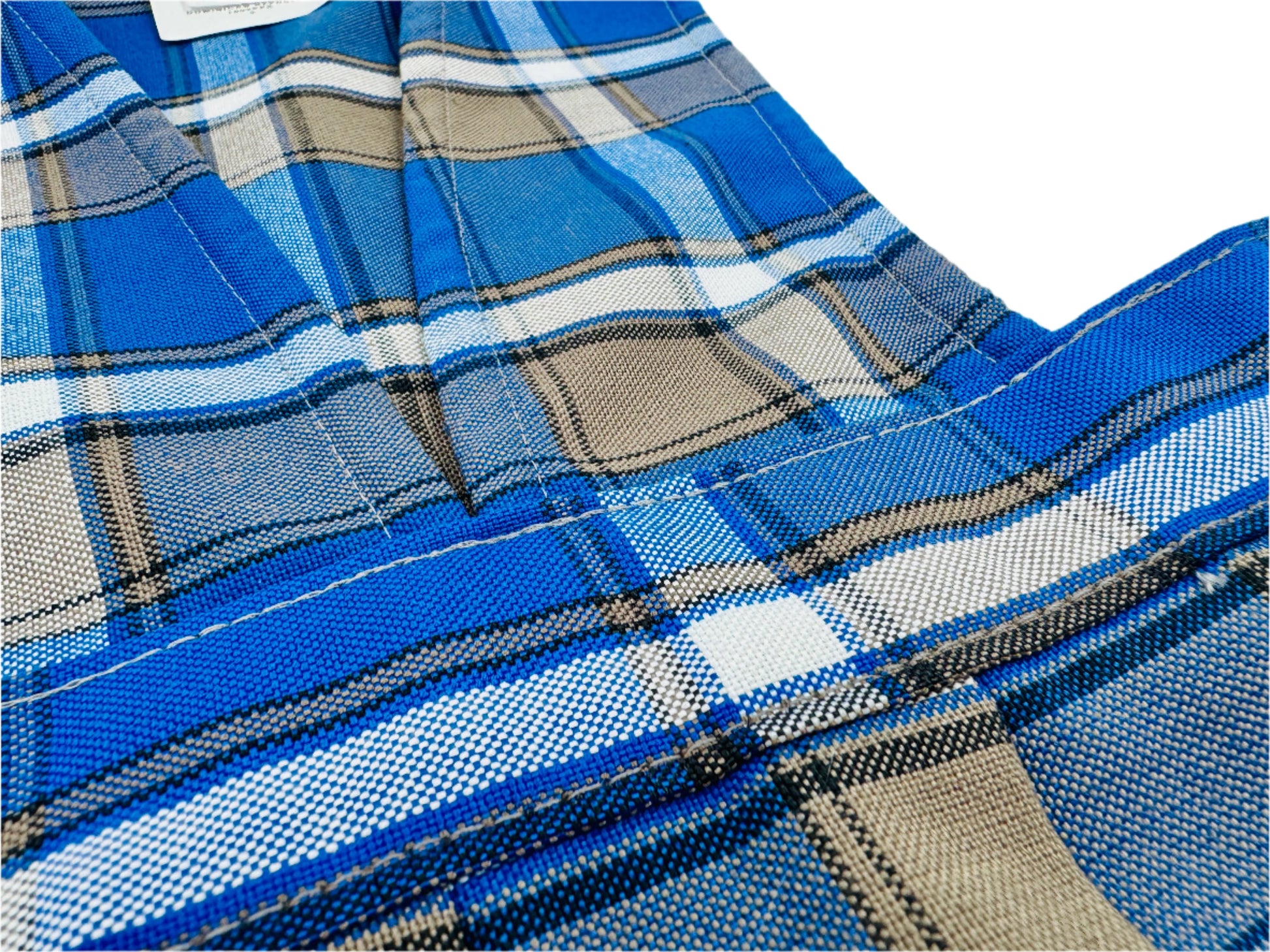 Close-up of blue plaid fabric with a white background